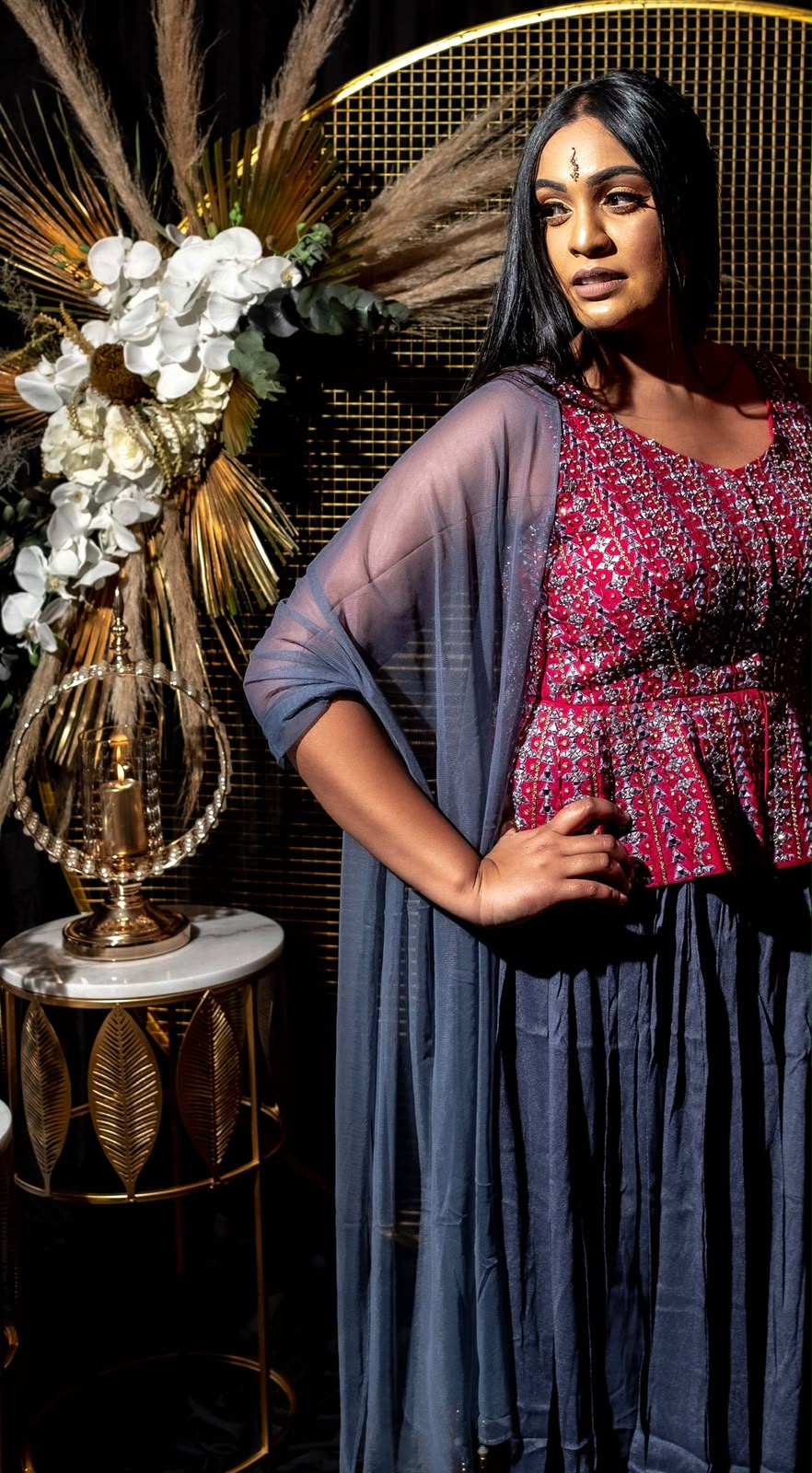 Crimson peplum top with draped dhoti pants and matching sheer dupatta